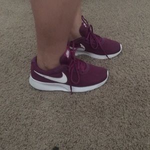 Purple Nike tennis shoes in fear condition.